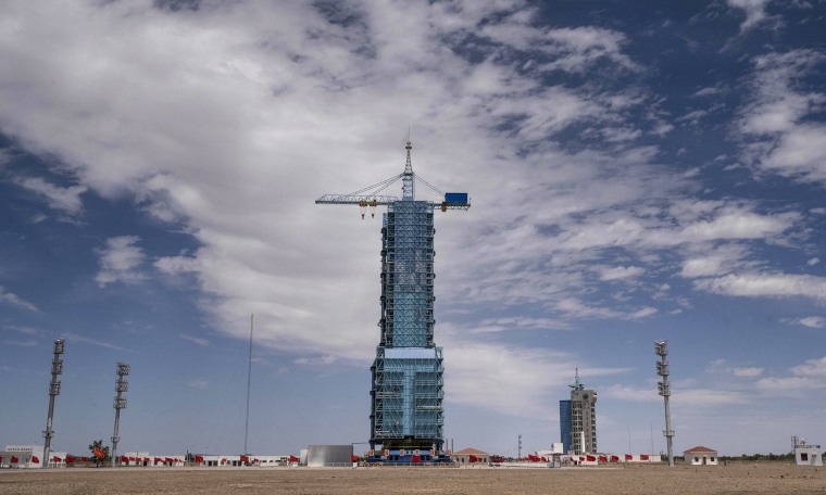 Image: The  launch platform housing the Shenzhou-12 spacecraft and Long March-2F rocket is seen at the Jiuquan Satellite Launch Center