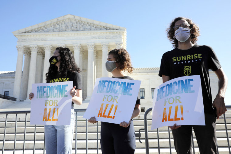 Demonstrators rally outside U.S. Supreme Court in Washington before in an argument on the Affordable Care Act on Nov. 10, 2020.