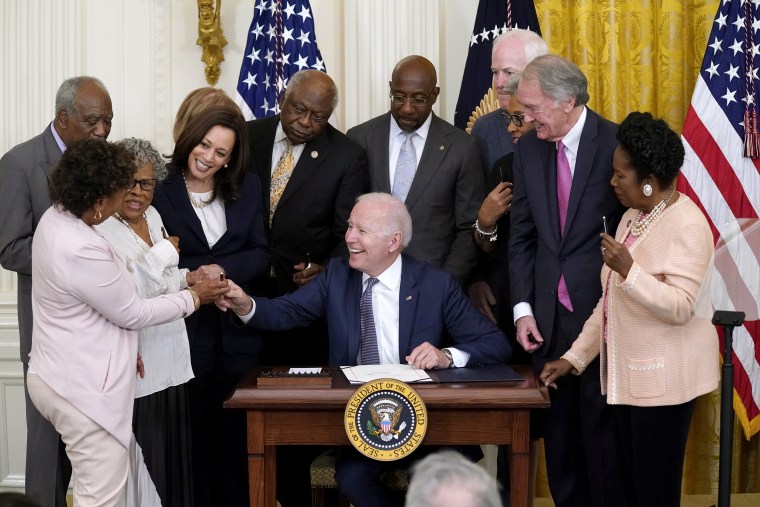 Image: President Joe Biden hands a pen to Rep. Barbara Lee, D-Calif., after signing the Juneteenth National Independence Day Act, in the East Room of the White House on June 17, 2021.