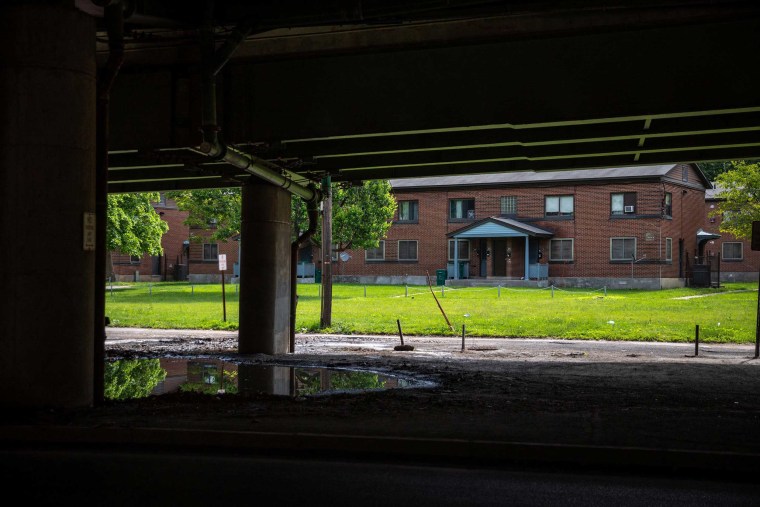 Image: View from under the viaduct of the Pioneer Homes apartments, a public housing projects in the shadow of I-81 in Syracuse, N.Y.