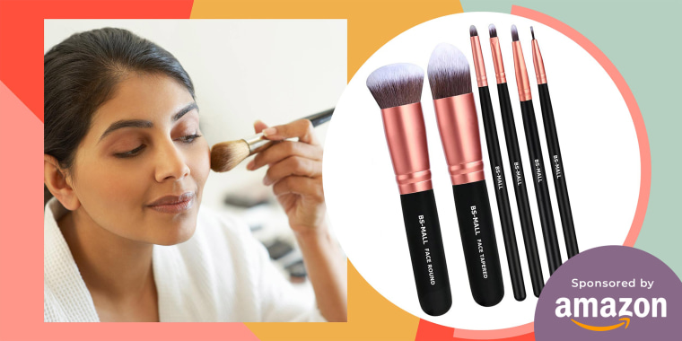 Woman applying make up with brush and a rose gold brush set
