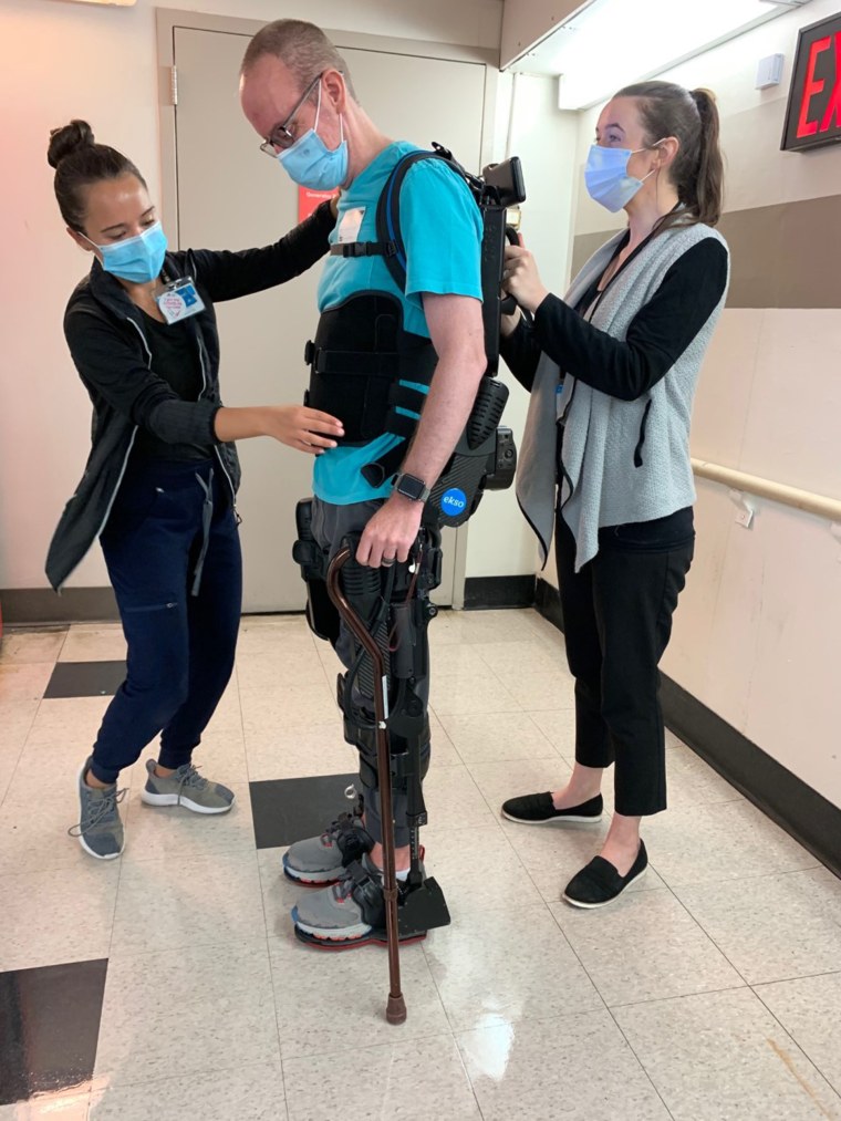 At Mount Sinai’s Abilities Research Center, Jon Mender participates in the exoskeleton program, which helps his body repeat certain motions that in turn train his brain to remember a walking gait, for example. 