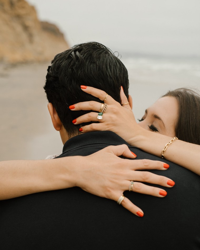 The unique, custom-made engagement ring included an emerald for a sentimental reason. 