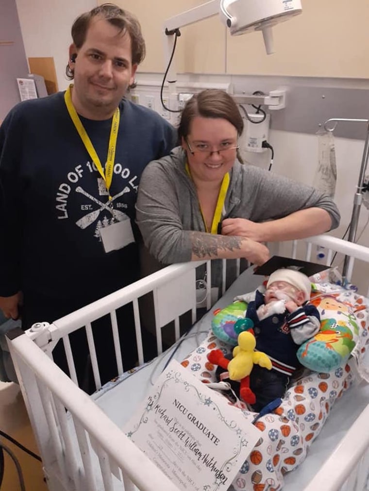 Beth and Rick Hutchinson with Richard on the day he graduated from the NICU.
