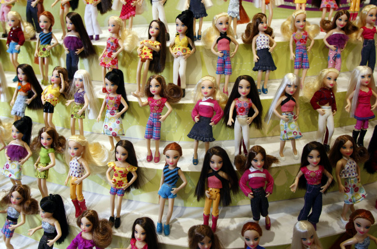 Polly Pocket 'pop-n-swap' fashion dolls are displayed at the
