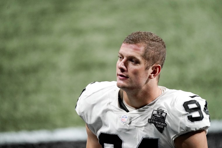 Las Vegas Raiders defensive end Carl Nassib (94) sits on the bench during  an NFL preseason football game against the Seattle Seahawks, Saturday, Aug.  14, 2021, in Las Vegas. (AP Photo/Rick Scuteri