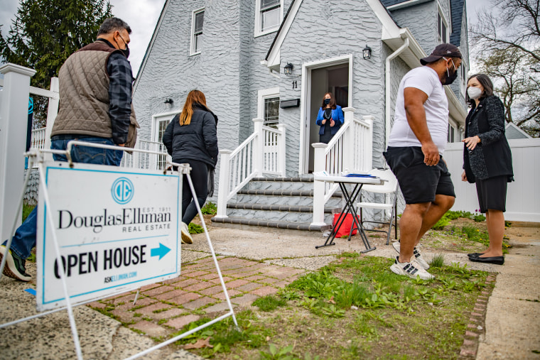 Real estate agents work an open house in West Hempstead, N.Y., on April 18, 2021.