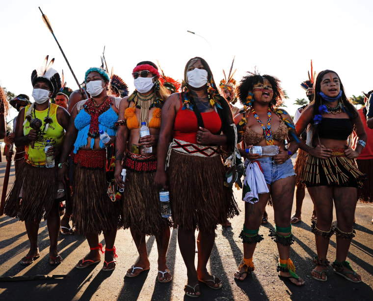 Image: Indigenous Brazilians protest land demarcation and Brazilian President Jair Bolsonaro at the Planalto Palace in Brazil on June 17, 2021.
