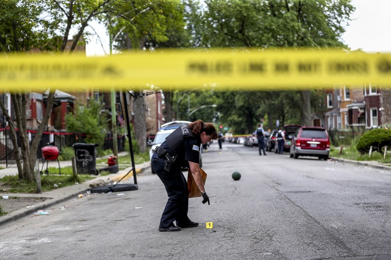 Judge: An officer collects evidence at the scene where an 8-year-old girl was shot on the 1000 block of North Monticello Avenue on Aug. 11, 2019 in Chicago.