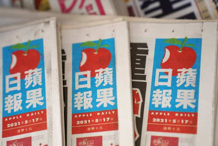 Image: Copies of Next Digital's Apple Daily newspapers at a newsstand in Hong Kong, China