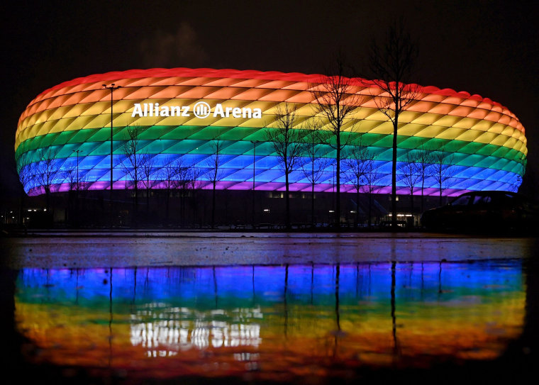 Image: The Allianz Arena stadium in Munich lit up in rainbow colors after a match.