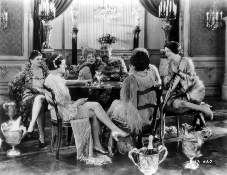 Image: Women dressed as flappers in a scene from the film "The Wedding March," in 1928.