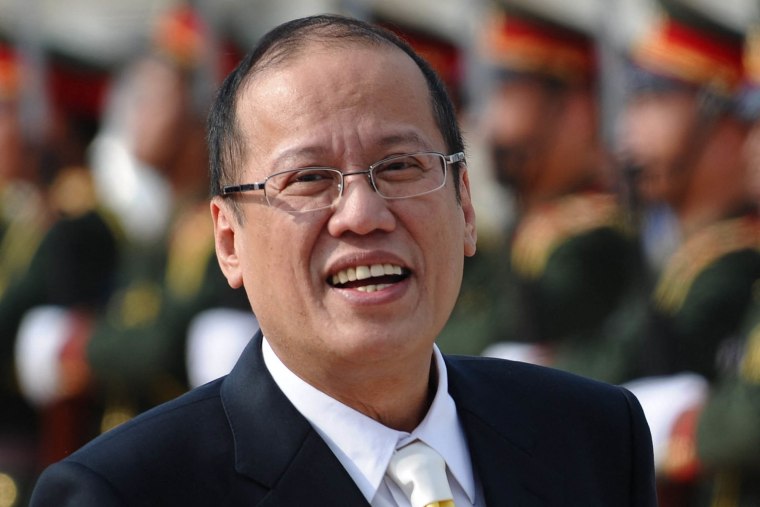 Image: Philippines' President Benigno Aquino smiling upon his arrival at Wattay airport to attend the ninth Asia-Europe summit in Vientiane