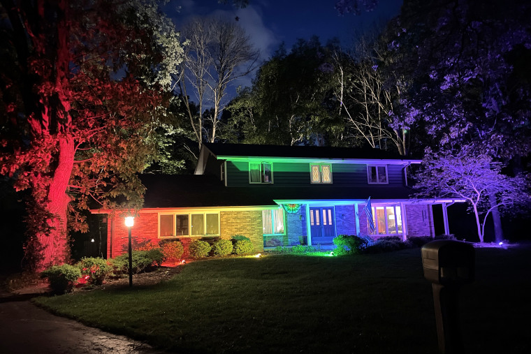 The house of Memo Fachino and Lance Mier lit in rainbow lights.