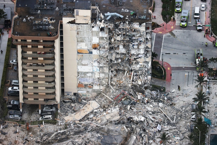 Search and Rescue personnel work after the partial collapse of the 12-story Champlain Towers South condo building on June 24, 2021, in Surfside, Fla.