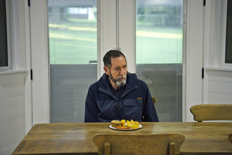 Jim Champion, 75, eats breakfast.