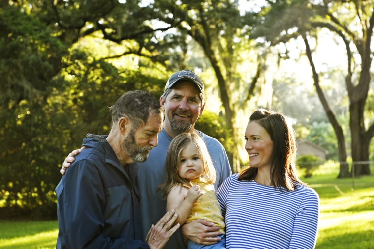 Christian Dickinson and his wife, Morgan Champion, with their daughter, Darcy, and Morgan's father, Jim Champion.