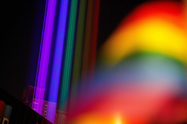 Rainbow lights are projected skyward near the Stonewall Inn on June 24, 2021, in New York.