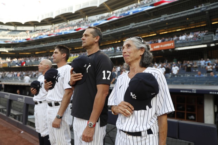 Gwen McLoughlin, right, got to rub elbows with some of the biggest names on the Yankees, including manager Aaron Boone, to her right.