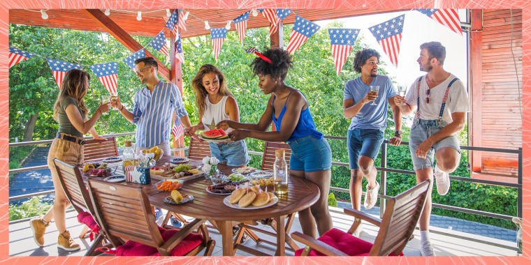 Friends celebrating US Independence Day with an outdoor backyard bbq