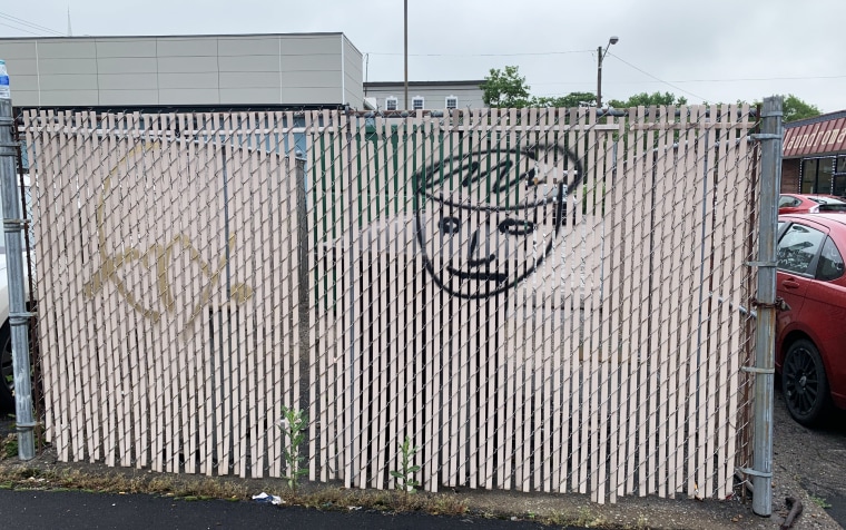 Fence with graffiti on it