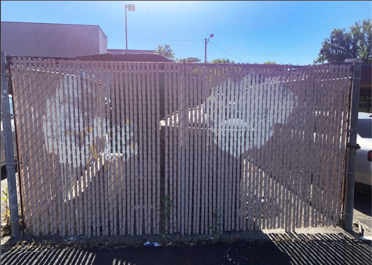 Fence with graffiti on it