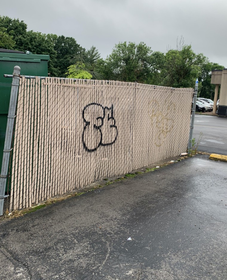 Fence with graffiti on it