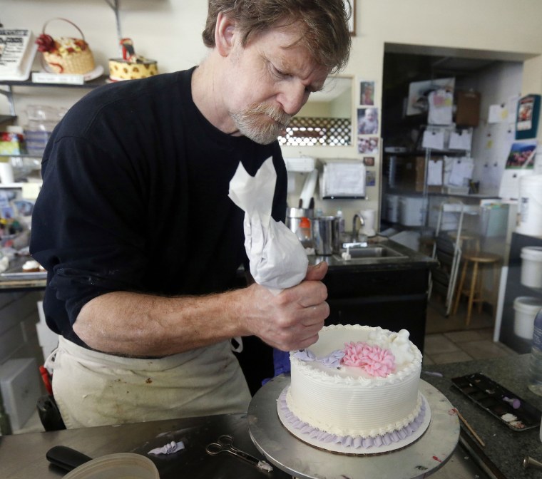 Image: Masterpiece Cakeshop owner Jack Phillips decorates a cake inside his store in Lakewood, Colo., on March 10, 2014.