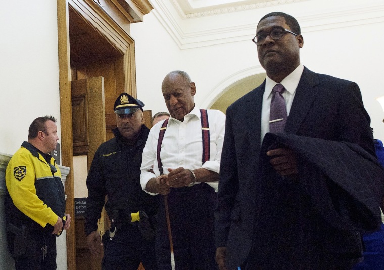 Image: Bill Cosby, center, leaves the courtroom after he was sentenced to three-to 10-years for felony sexual assault
