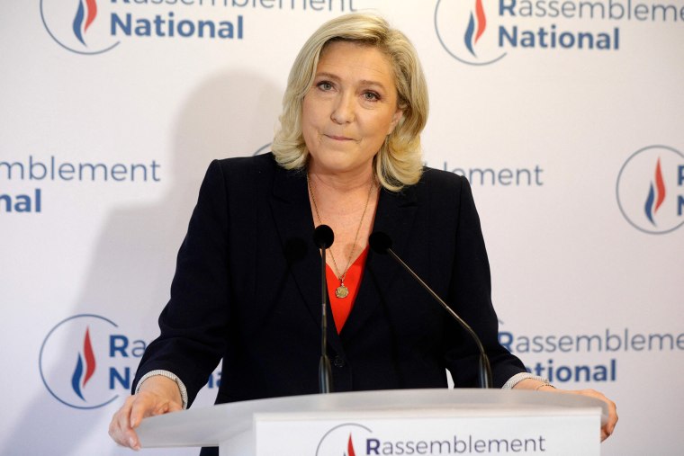 Image: French far-right leader and member of parliament Marine Le Pen speaks to the press at the party's headquarters after the first results in the second round of the French regional elections