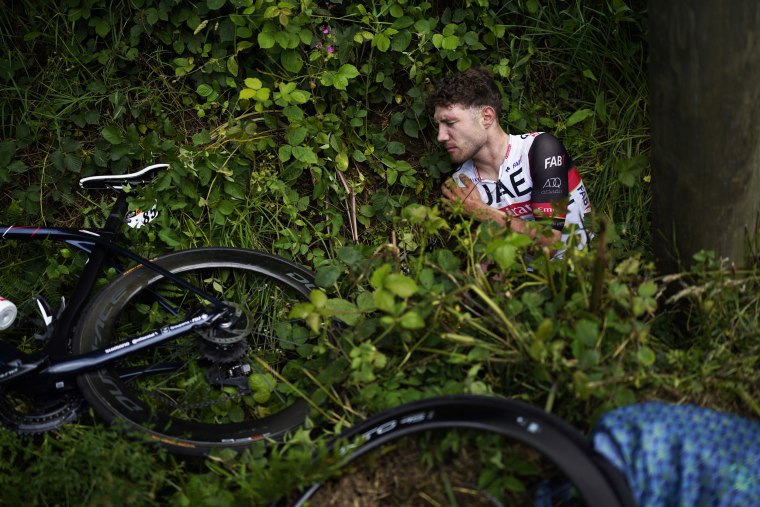 Switzerland's Marc Hirschi lays on the side of the road after crashing during the first stage of the Tour de France on June 26, 2021.