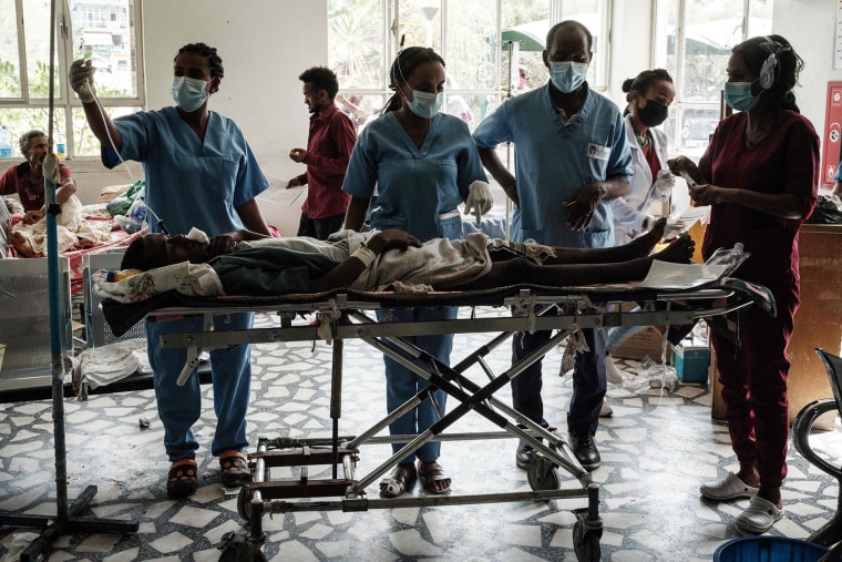 Image: People who were injured in their town Togoga in a deadly airstrike on a market, receive medical treatments at the entrance hall of the Ayder referral hospital in Mekele