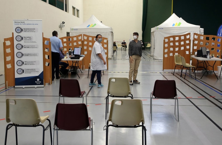 Image: Volunteers stand in a vaccination center in Capbreton, in the Landes region, southwestern France