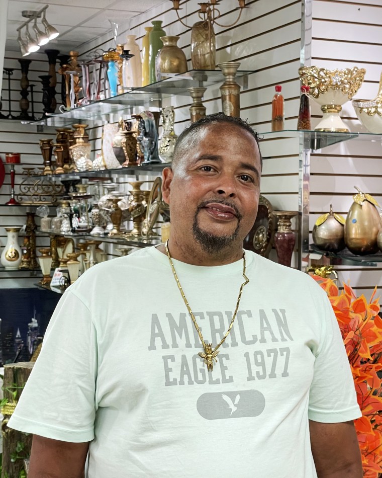 Jose Gonzalez stands inside Thalia Decoraciones, a small business he owns with his mother in Washington Heights, N.Y.