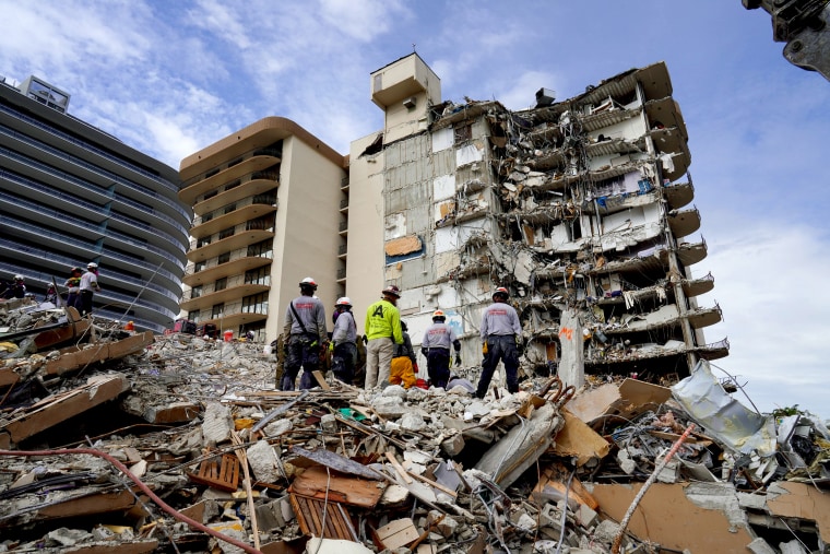 Image: Search and rescue personnel work at the site of a collapsed Florida condominium complex in Surfside, Miami, U.S. in this picture obtained from social media