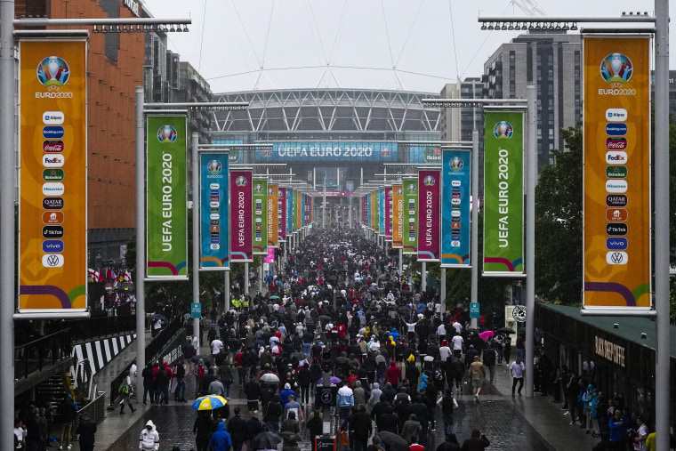 Image: Supporters make their way to Wembley stadium in London