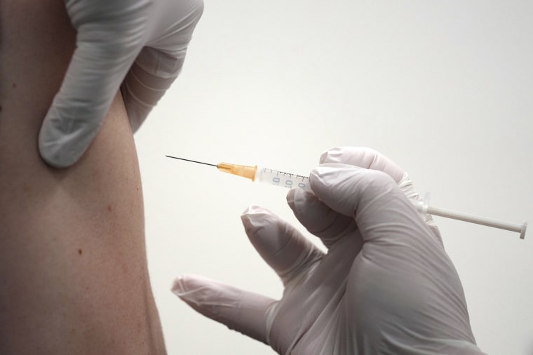 Image: A local resident receives the Moderna Covid-19vaccine shot at a center Wednesday, June 30, 2021, in the Sumida ward of Tokyo.