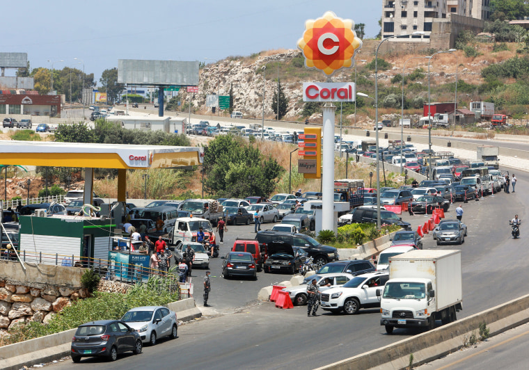 Image: Cars form a line at a gas station as they wait to fuel up in Damour, Lebanon.