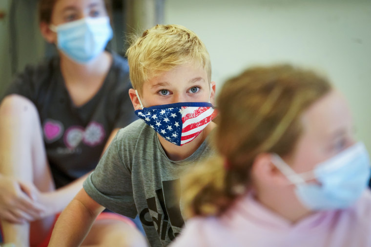 Fifth graders wear face masks during a music class at the Milton Elementary School, on May 18, 2021, in Rye, N.Y..