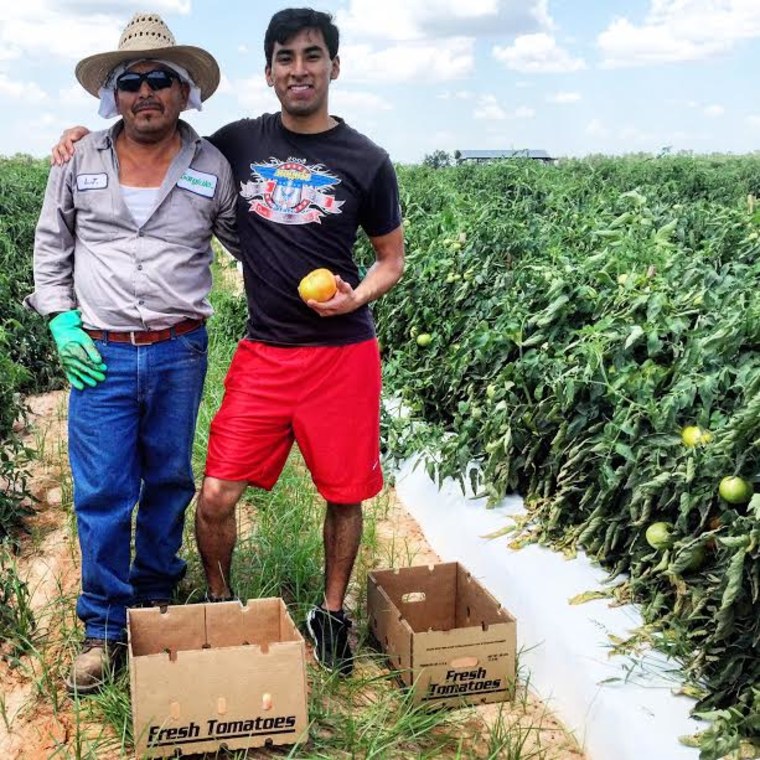 Erick Juárez with his father at a tomato field in their home county of Decatur County, GA, in 2015 shortly after he graduated from Harvard.