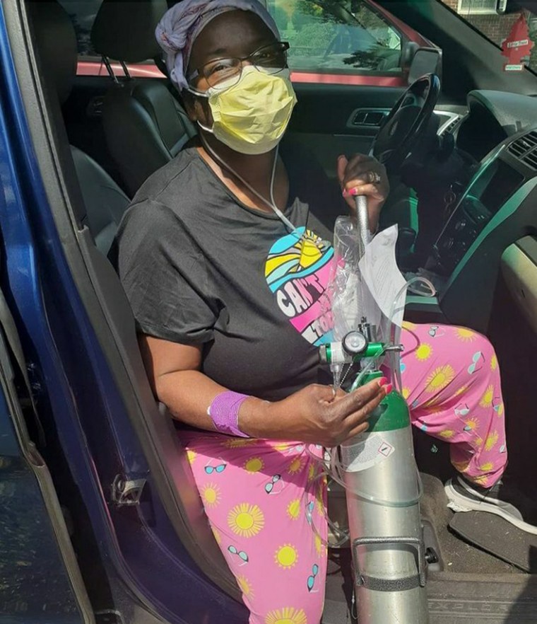 After being hospitalized for five days, Yvonne Gloston heads home with her oxygen tank.