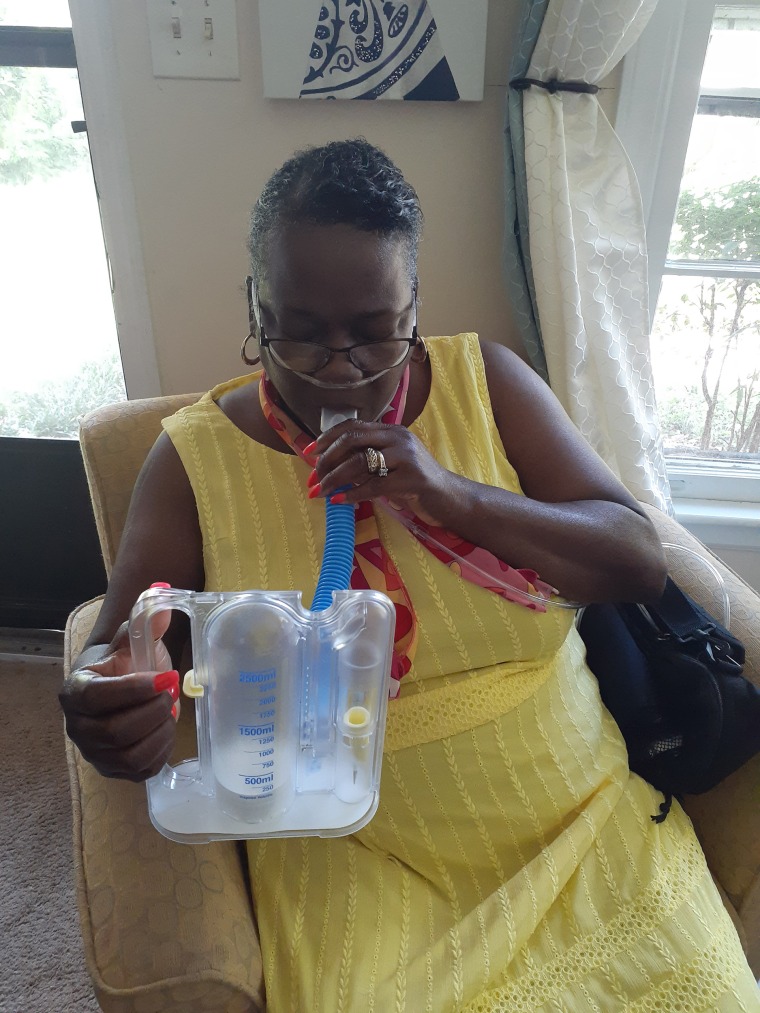 Gloston uses a device to check her lung capacity at home. She also has to check her oxygen levels regularly with a pulse oximeter.