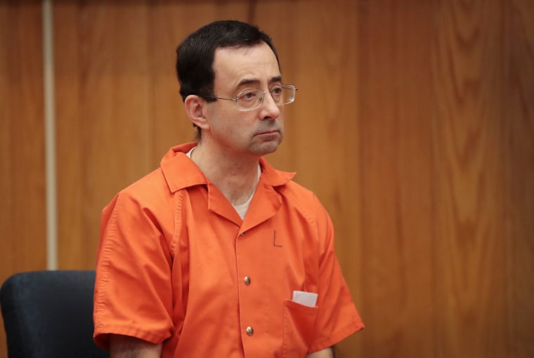Image: Larry Nassar sits in court listening to statements before being sentenced