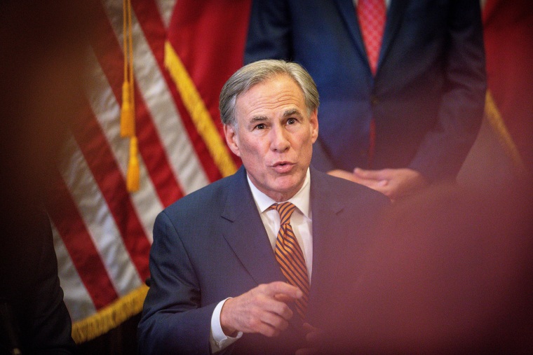 Image: Texas Governor Greg Abbott speaks during a press conference where he signed Senate Bills 2 and 3 at the Capitol