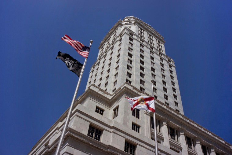 Historic Miami-Dade County Courthouse building in downtown Miami. The black flag in the picture is POW/MIA flag