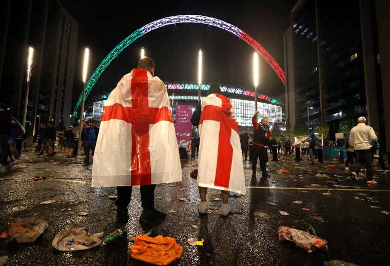 Image: England fans outside Wembley Stadium after Italy's win