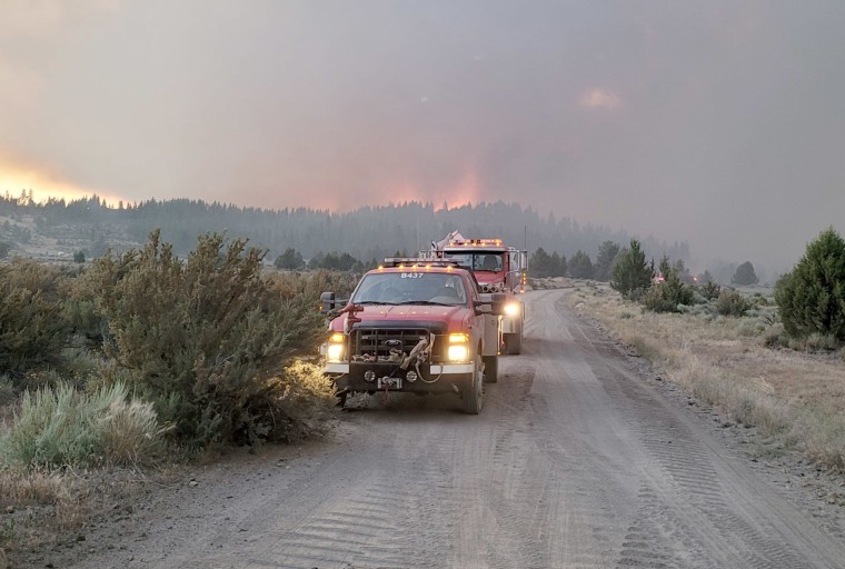 Image: Emergency services attend the Bootleg Fire in Oregon, July 11, 2021.