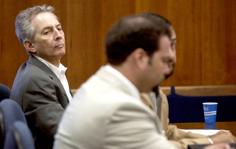 Robert Durst, left, sits in a courtroom during a pre-trial hearing at the Galveston County Courthouse in Galveston, Texas on Aug. 18, 2003.