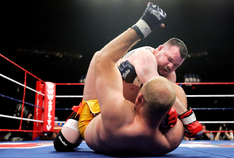 Travis Fulton, top, of the Red Bears fights Ben Rothwell of the Silverbacks on May 19, 2007 at the Sears Centre in Chicago.