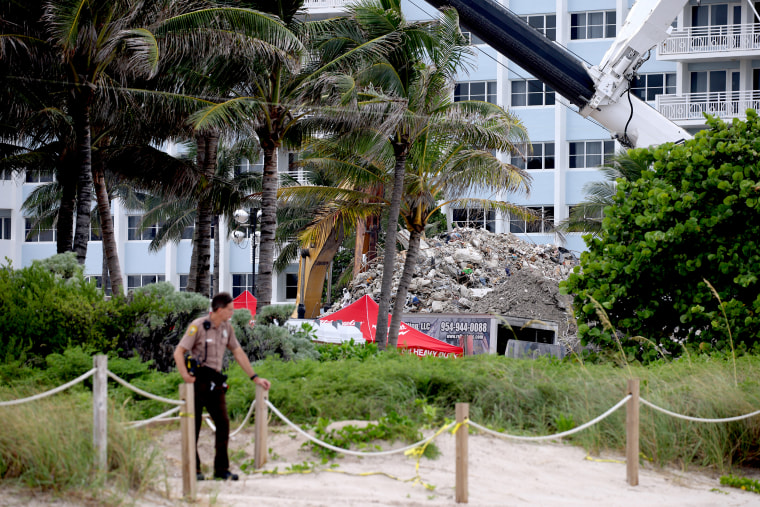Image: A pile of debris from the collapsed 12-story Champlain Towers South condo building is seen from the beach on July 12, 2021 in Surfside, Fla.